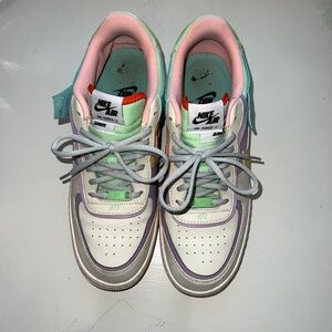 Nike White and Pink Athletic Shoes Low-Top Design